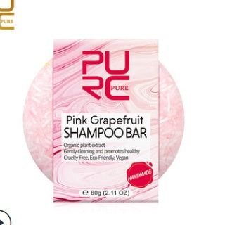 Pink grapefruit shampoo bar with 'PURE' branding on a white background