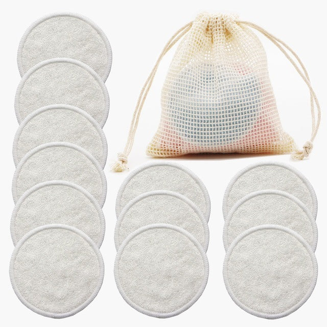 Set of reusable makeup remover pads with a mesh storage bag on a white background