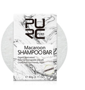 Macaron shampoo bar with packaging labeled 'PURE' on a white background