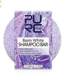 Purple shampoo bar packaging with 'PURE' branding on a white background