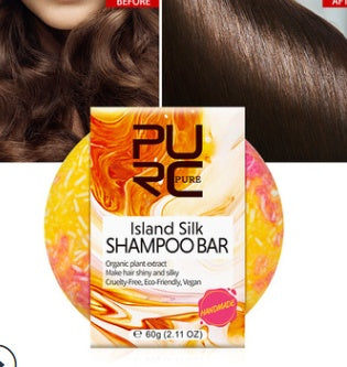Shampoo bar packaging with 'PURE' branding and island silk design.