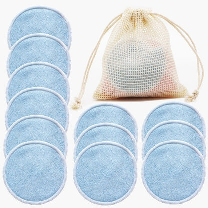 Set of blue reusable makeup pads with a mesh storage bag on a white background