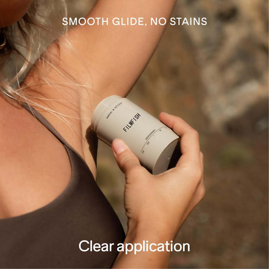 Person using a clear hair removal product on their arm with text 'Smooth glide, no stains' and 'Clear application'.